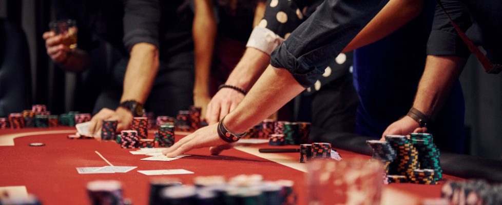 people-elegant-clothes-standing-playing-poker-casino-together(1)